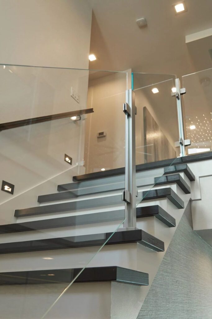 This image has a glass balcony railing