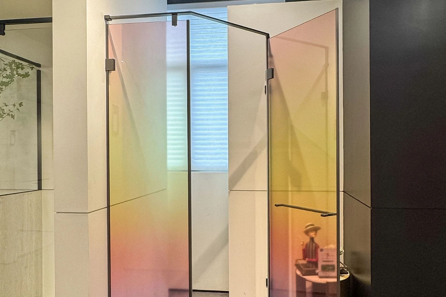 This image has an neo angle glass shower door