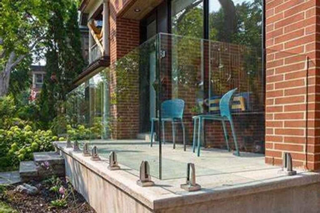 This image has a glass balcony railing